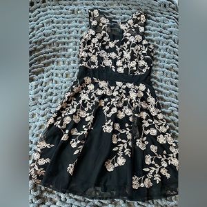 Black zip up dress with pink flower design